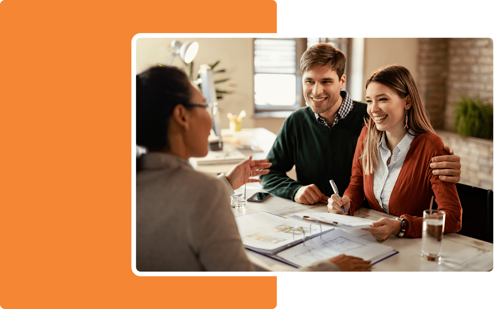 Happy couple meeting with a financial advisor