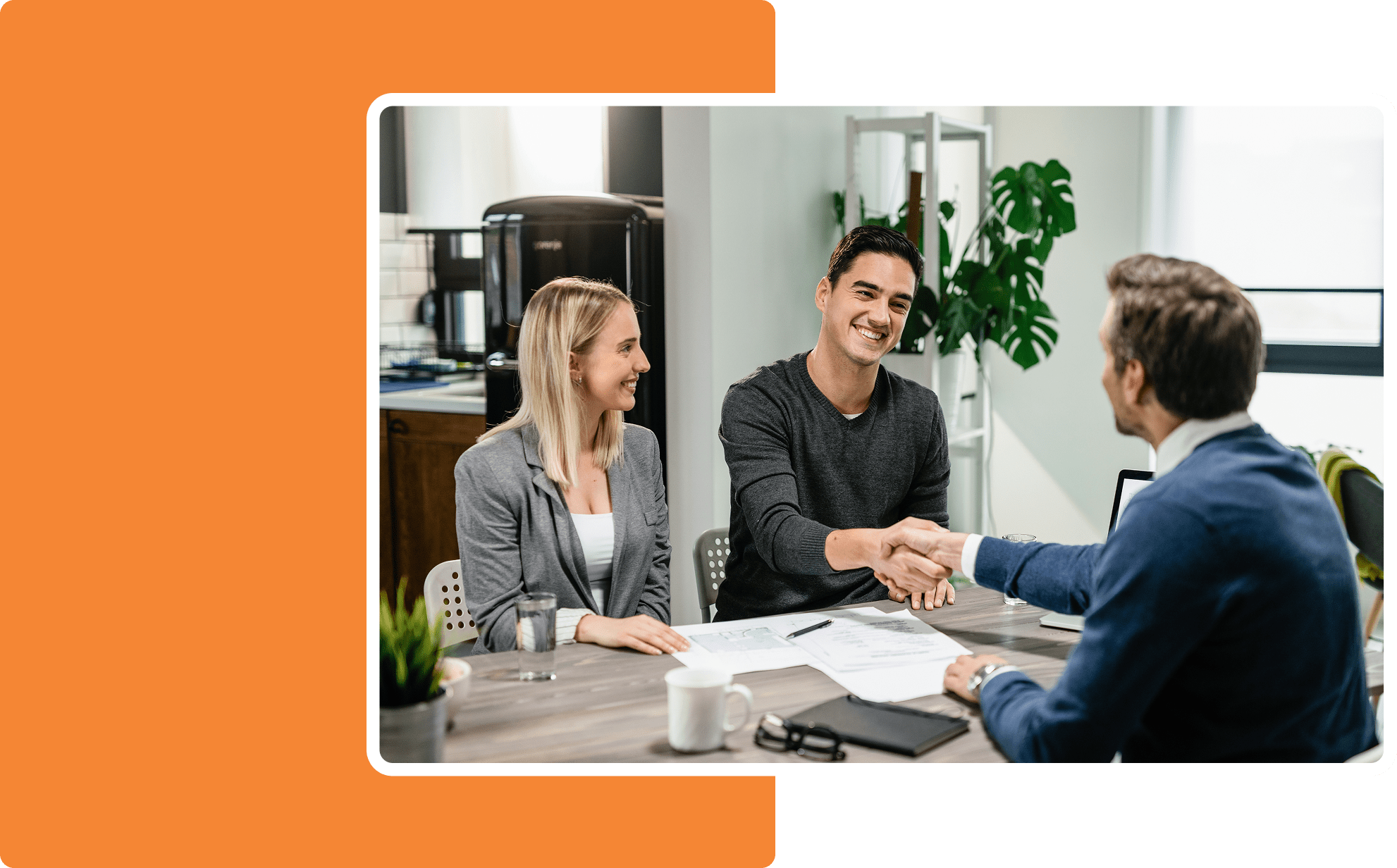 Happy couple meeting with a financial advisor